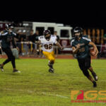 JFK Islander's Aiden Quitigua runs upfield for a first down in the third quarter. (Photo By Michael Blas)