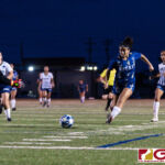 ND Royals Lauren Phillips keeps her momentum as she takes another shot on goal. (Photo by Michael Blas)