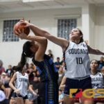 Academy Cougars Mia San Nicolas makes a huge block on Notre Dame Royals Haley Salas. (Photo by Michael Blas)