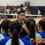 St. Paul Christian Warrior's Coach Al Garrido preps his team before the start of the third set. (Photo by Michael Blas)