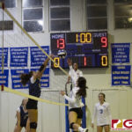 Guam High Panthers Eden French & Notre Dame Royals Gia Camacho meetup between the net. (photo by Bout It Productions)