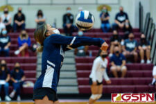 Academy Cougar Talen Topasna rushes to receive the ball at the edge of the sideline. (Photo by Michael Blas)