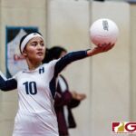 Harvest Eagle Selina Navarro gets ready to serve in the first set of the game. (Photo by Michael Blas)