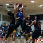 GW Geckos Dylan Trusso looks for the bucket as he gets swarmed by the FD Friars defense. (Photo by Michael Blas)