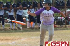 Gecko catcher Rocki Mesa flips the bat to the dugout after drawing a base on balls. (photo by Robert Balajadia)