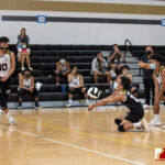Tiyan High Titan Gavin Macapagal goes low to send the ball back to the other side. Photo by Bout It Productions