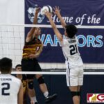 St. Paul Warriors John Kyle Rabino gets up for a block on FD Friars Brian Anderson. (Photo by Michael Blas)