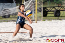 Harvest Eagle Samantha Lorzano connects with the ball in the second set against the St. John's Knights. (Photo by Michael Blas)