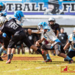 Raiders Peter Mesa spins out of several Angel tackles and runs down field for a 70 yard touchdown. (Photo by Michael Blas)