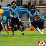 Southern Dolphin Conan Baza looks for open space on his run in the first half of the game. (Photo by Michael Blas)