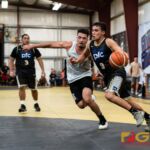 PFC Islanders Billy Beiger drives the ball towards the net while Guam Elite Friars Will Stinnett trails him. (Photo by Michael Blas)