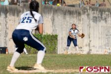 Academy Cougar Olivia Salas sends the ball down to first baseman Jordan Limtiaco. (Photo by Michael Blas)