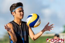 St. Paul Warrior Keith Nauta prepares to serve in the second set of the matchup. (Photo by Michael Blas)