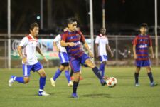 Bank of Guam Strykers' Ian Mariano controls the ball ahead of Quality Distributors' Yu Tanabe during a Week 11 match of the Budweiser Soccer League Premier Division Saturday at the Guam Football Association National Training Center. The Strykers won 2-1.