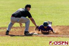 GW Gecko runner makes it safely back to first base before Islander Vince Camacho can get to him. (Photo by Michael Blas)