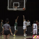 St. John Knights Don Pangelinan attempts a maneuver to throw off his defender. (photo by Bout It Productions)