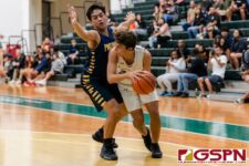 Harvest Eagle Taka Ward looks for the assist against Guam High Panther Damien Dela Cruz. (Photo by Michael Blas)