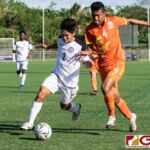Guam Matao Isiah Lagutang fights off Bhutans Jigme Dorjee to maintain possession. (Photo by Michael Blas)