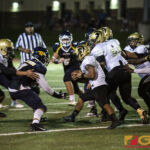 Tiyan High Titans Christopher Cowart looks for an opening from the defense. (photo by Bout It Productions)