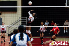 St. John's Knight Knessa Davis loads up for a spike in the first set of the game. (Photo by Michael Blas)