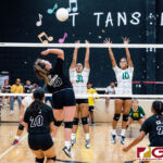 Tiyan Titan Rylee Guzman loads up for a spike as Islander Hannah Hular, left, and Kiana Rivera, right, get up to contest. (Photo by Michael Blas)