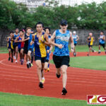 GW Gecko Paul Mansfield and Southern Dolphin Carlos Leon Guerrero lead the rest of the pack early on into the race. (Photo by Michael Blas)