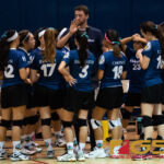 Harvest Eagles coach Matthew Noland gives his team some pointers prior to entering the second set of the game. (Photo by Michael Blas)