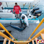 Angela Gale brings in a Marlin at Agana Boat Basin for the 24th Annual Guam Marianas International Fishing Derby. (Photo by Michael Blas)