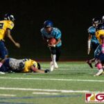 Southern Dolphin RB Conan Baza glides out of a tackle from Guam High Panther Matua Whalen. (Photo by Michael Blas)