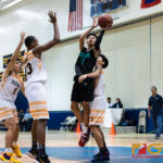 Southern High Dolphins Elijah Cruz finds an opening and knocks in a left handed floater. (Photo by Michael Blas)