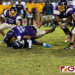 George Washington Geckos Jose San Miguel makes a tackle on Guam High Panthers Sincere Powell. (Photo by Michael Blas)