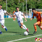 Bhutans Chencho Gyeltshen drives towards goal while Guams Shawn Nicklaw and Mark Chargualaf mark up. (Photo by Michael Blas)