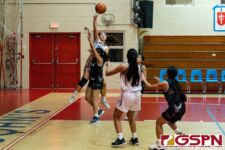 St. John's Knight Tylee Shepherd fakes a floater and passes to Jadyn Palomares for two. (Photo by Michael Blas)