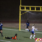Academy Cougars goal keeper Phoebe Shmull looks back after seeing the ball get by her. (photo by Bout It Productions)