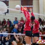 St. John's Knights Angeline Del Carmen denies AOLG Cougars Alexandra Lekites from a kill. (Photo by Michael Blas)