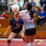 AOLG Cougars Talen Topasna bumps a returned ball from the St. John's Knights. (Photo by Michael Blas)