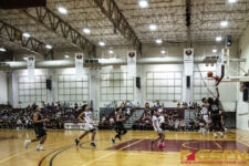 JFK Islanders Jeremiah Kintoki gets past the FD Friars defenders and earns his two points. ( photo by Bout It Productions )