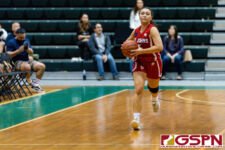 St. John's Knight Tylee Shepherd brings the ball downcourt in the second half of the game. (Photo by Michael Blas)
