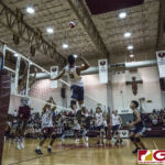 Harvest Eagles Mason Caldwell goes airborne to deliver a spike over the net. (photo by Bout It Productions)