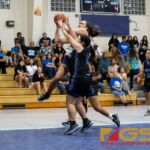 Academy Cougars Mia San Nicolas gets the ball up and through the net early on in the first quarter. (Photo by Michael Blas)