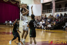 FD Friars Daryll Robles goes up for the shot attempt while JFK Islanders Dean Weilbacher looks to defend. ( photo by Bout It Productions )