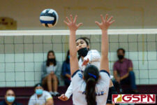 Academy Cougar Kristen Serrano finds an opening against the ND Royal blockers. (Photo by Michael Blas)