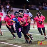 Southern High Dolphins QB Ethaniel Escuadra keeps the ball and runs for the first down. (Photo by Michael Blas)