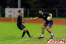 JFK Islander Noah Mueller celebrates with an Islander supporter after scoring a goal. (Photo by Michael Blas)