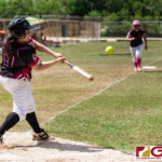 Queen B's Ritanna Pocaigue hits the ball outfield to bring in her teammates. (Photo by Michael Blas)