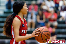 St. John's Knight Yasmeen Lopez brings the ball down court in the first quarter of the game. (Photo by Michael Blas)