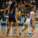 St. Paul Warriors Kirsten Silva keeps hold of possession to run down the clock. (Photo by Michael Blas)