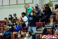 The Academy Cougar fans cheer as their team increases the lead in the 4th set. (Photo by Michael Blas)