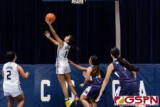 Academy Cougar Maria Taitano hits a layup on a fast break in the fourth quarter. (Photo by Michael Blas)