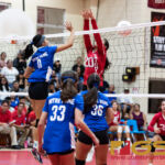 Notre Dame Royals Ella Balajadia lands a kill shot past St. John's Knights Hallie Wigsten. (Photo by Michael Blas)